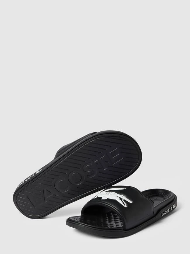 Lacoste Slides Mit Label-Applikation Modell 'Croco Dualiste' - Schwarz 7 Lacoste Slides Mit Label-Applikation Modell 'Croco Dualiste' - Schwarz – Bild 5