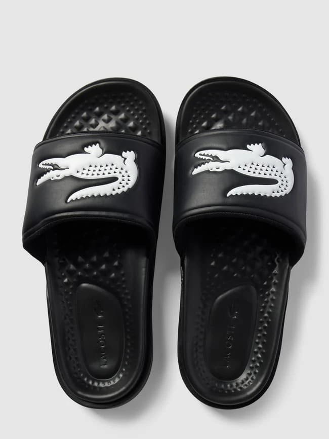 Lacoste Slides Mit Label-Applikation Modell 'Croco Dualiste' - Schwarz 6 Lacoste Slides Mit Label-Applikation Modell 'Croco Dualiste' - Schwarz – Bild 4